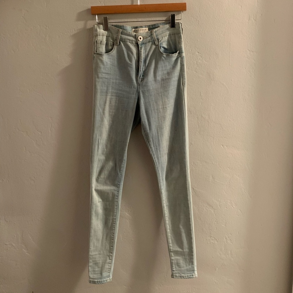 Light wash denim jeans by Bullhead Denim